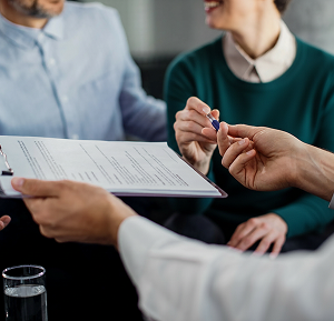 handing over the pen