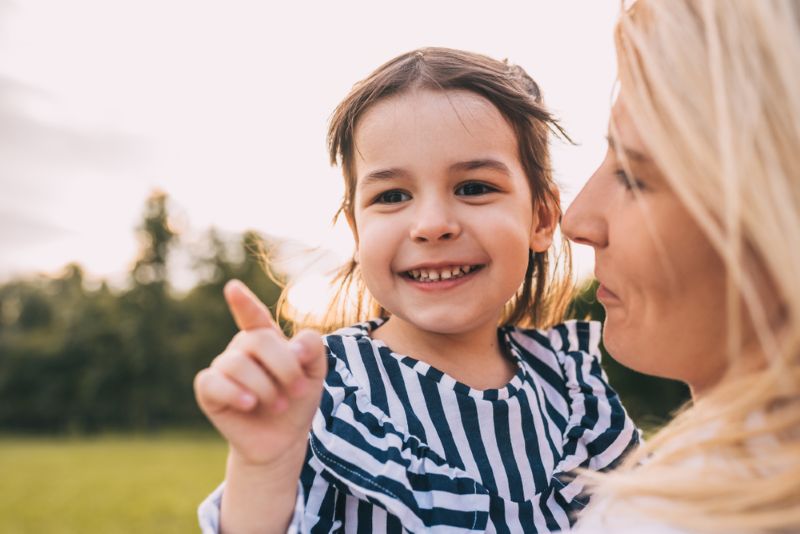 Mother with young daughter outdoors